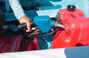 Man filling fuel can
